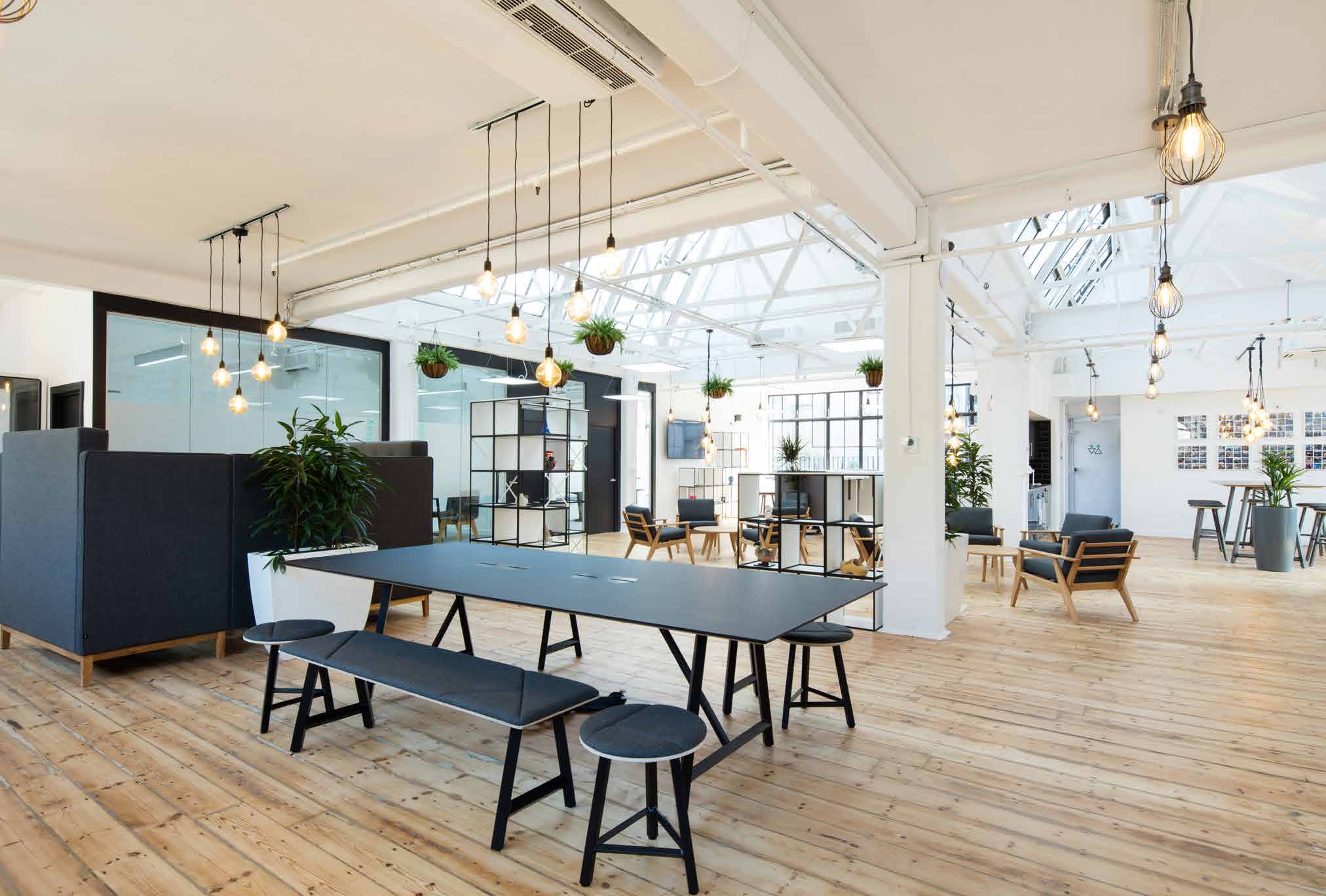Completed Checkout.com workplace with restored timber floors, daylight and informal meeting spaces